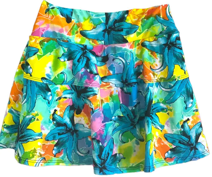Embrace vibrant style with the Nola Neon Garden Skirt. Bursting with color & floral patterns, it's a statement piece for any occasion.