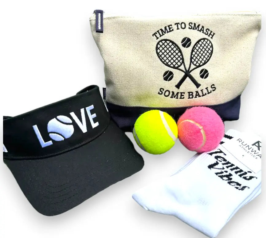 Score big with our Tennis Gift Set. Perfect for tennis enthusiasts, it includes accessories for the game.  Thoughtfully curated and sure to delight.