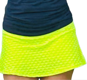 Neon Yellow Tennis Skirt from Runway Athletics. The Nola neon yellow tennis skirt is made of Nylon Spandex and has a under-short.