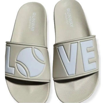 Rubber slides in Beige & White- Runway Athletics. These are embossed not printed. we create a mold for every slide.